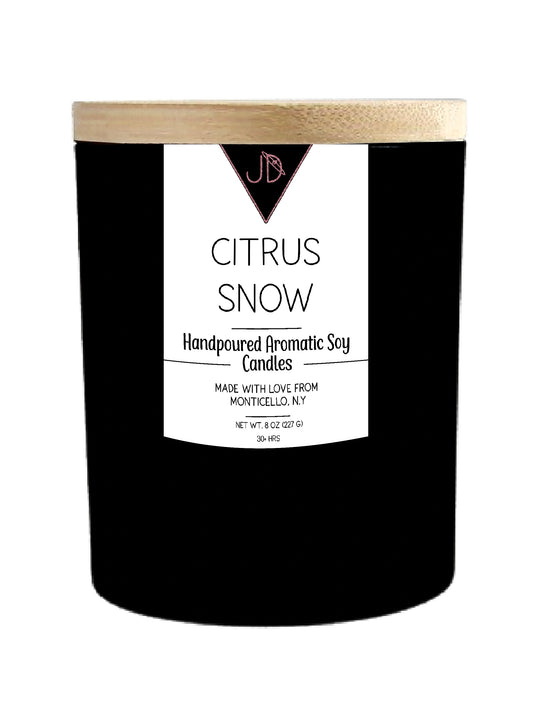 The scent of the first snowfall wrapped around fresh-cut citrus. Citrus Snow opens with a bright burst of winter berry and orange, warming into cozy cinnamon and clove, before melting into a soft dry-down of French vanilla and musk.

It's crisp and sweet all at once — the kind of scent that makes a room feel like the holidays, no matter the date on the calendar.

Hand-poured in small batches in Monticello, NY using clean-burning soy wax and a cotton wick, Citrus Snow burns true to scent for 30+ hours. Finis